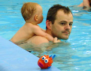 baby swim on dads back