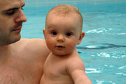 baby and dad swimming