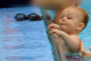picture of baby holding on in pool