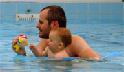 baby swimming with woggle